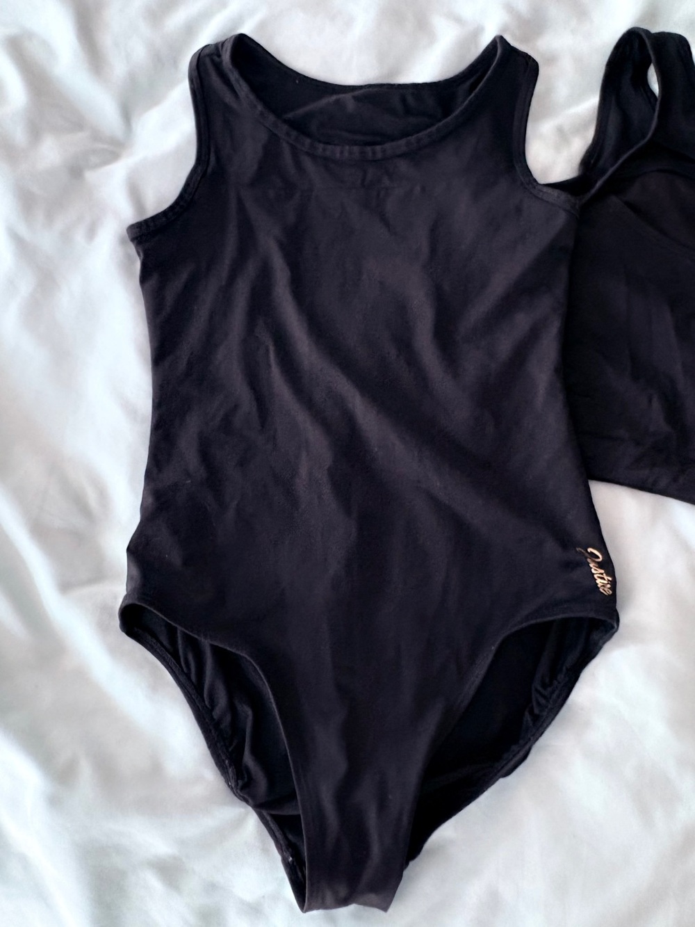 Two Justice Black Girls' leotard size, sleeveless with cross back detail, medium